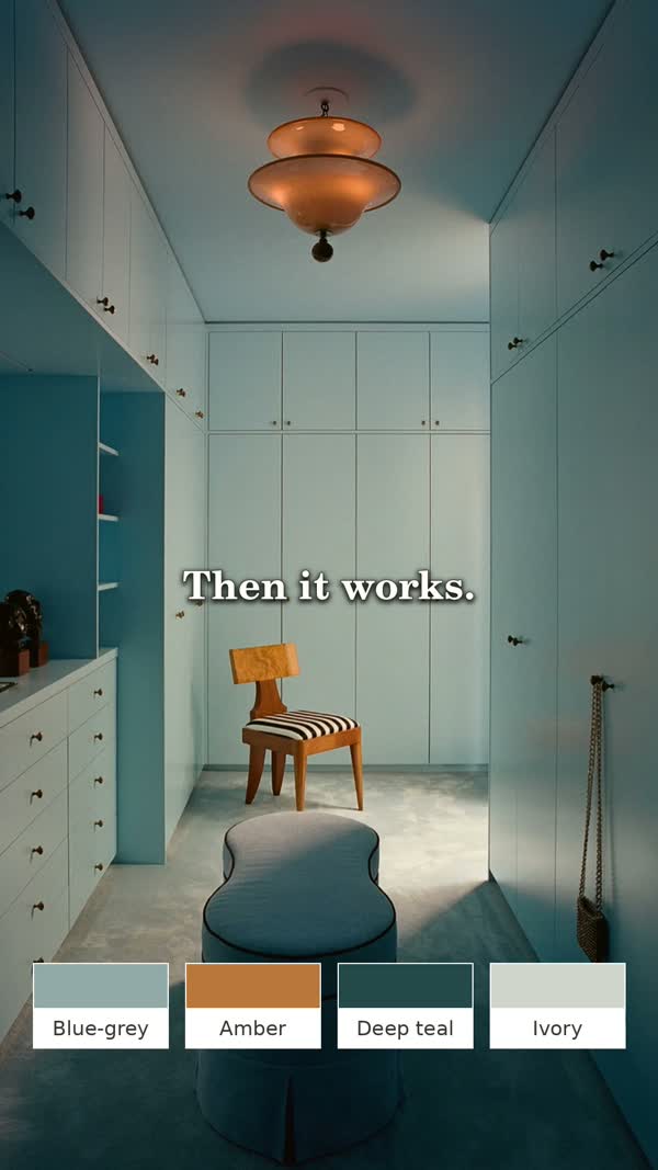 Illustrative blue-grey hallway with deep teal seating and an amber pendant, from the Maison Matière video.